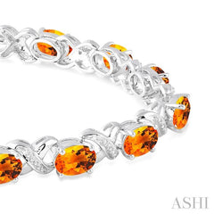 7x5 MM Oval Cut Citrine and 1/20 Ctw Round Cut Diamond Fashion Bracelet in Sterling Silver