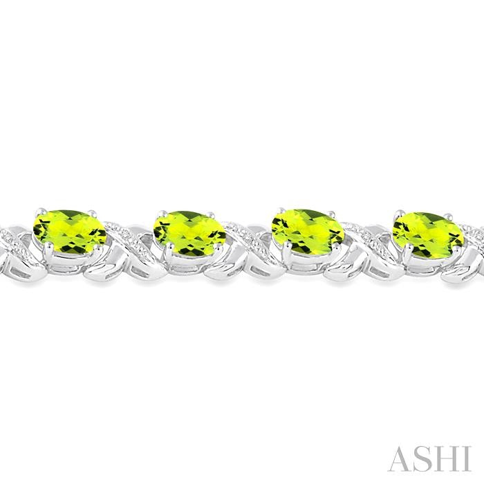 7x5 MM Oval Cut Peridot and 1/20 Ctw Round Cut Diamond Fashion Bracelet in Sterling Silver