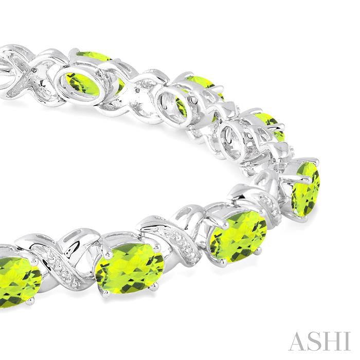7x5 MM Oval Cut Peridot and 1/20 Ctw Round Cut Diamond Fashion Bracelet in Sterling Silver