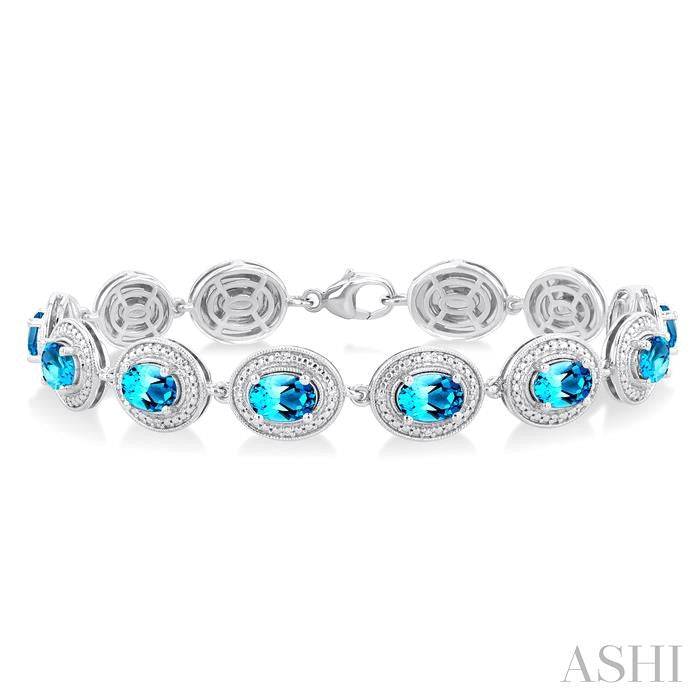 7x5 MM Oval Shape Blue Topaz and 1/10 Ctw Round Cut Diamond Semi-Precious Bracelet in Sterling Silver