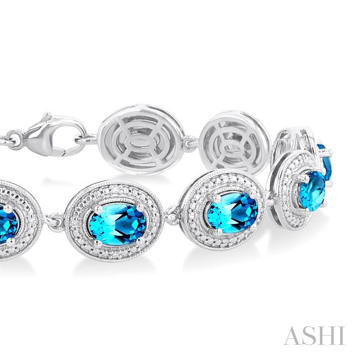 7x5 MM Oval Shape Blue Topaz and 1/10 Ctw Round Cut Diamond Semi-Precious Bracelet in Sterling Silver