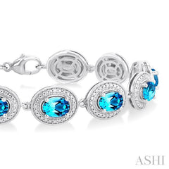 7x5 MM Oval Shape Blue Topaz and 1/10 Ctw Round Cut Diamond Semi-Precious Bracelet in Sterling Silver