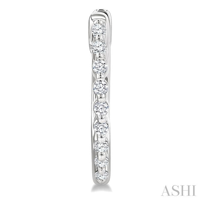 1/6 Ctw Petite Shared Prong Round Cut Diamond Hoop Earring in Sterling Silver