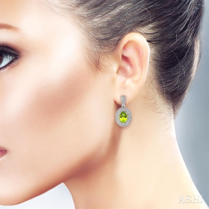 7x5 MM Oval Cut Peridot and 1/20 Ctw Round Cut Diamond Earrings in Sterling Silver