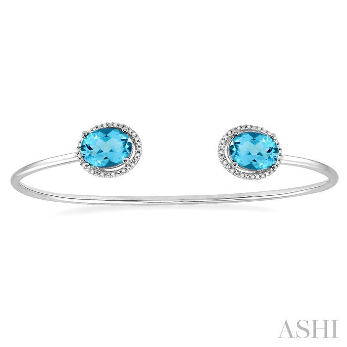 9x7 MM Oval Shape Blue Topaz and 1/10 Ctw Round Cut Diamond Bangle in Sterling Silver