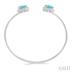 9x7 MM Oval Shape Blue Topaz and 1/10 Ctw Round Cut Diamond Bangle in Sterling Silver