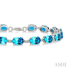 7X5 MM Oval Shape Blue Topaz and 1/10 Ctw Round Cut Diamond Semi-Precious Bracelet in Sterling Silver