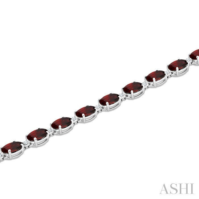 7X5 MM Oval Shape Garnet and 1/10 Ctw Round Cut Diamond Semi-Precious Bracelet in Sterling Silver