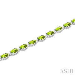7X5 MM Oval Shape Peridot and 1/10 Ctw Round Cut Diamond Semi-Precious Bracelet in Sterling Silver