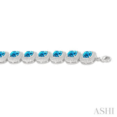 7 MM Oval Shape Blue Topaz and 1/10 Ctw Round Cut Diamond Semi-Precious Bracelet in Sterling Silver