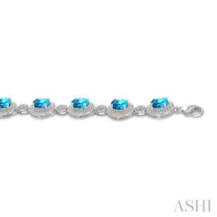 7X5 MM Oval Shape Blue Topaz and 1/10 Ctw Round Cut Diamond Semi-Precious Bracelet in Sterling Silver