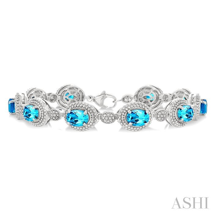 7X5 MM Oval Shape Blue Topaz and 1/10 Ctw Round Cut Diamond Semi-Precious Bracelet in Sterling Silver
