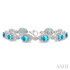 7X5 MM Oval Shape Blue Topaz and 1/10 Ctw Round Cut Diamond Semi-Precious Bracelet in Sterling Silver
