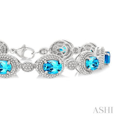 7X5 MM Oval Shape Blue Topaz and 1/10 Ctw Round Cut Diamond Semi-Precious Bracelet in Sterling Silver