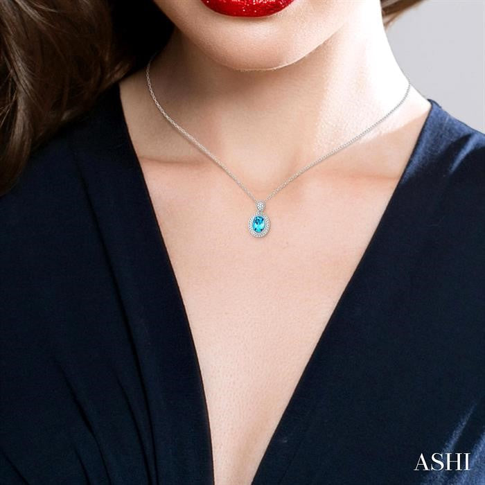 8X6 MM Oval Cut Blue Topaz and 1/20 Ctw Round Cut Diamond Semi-Precious Pendant With Chain in Sterling Silver