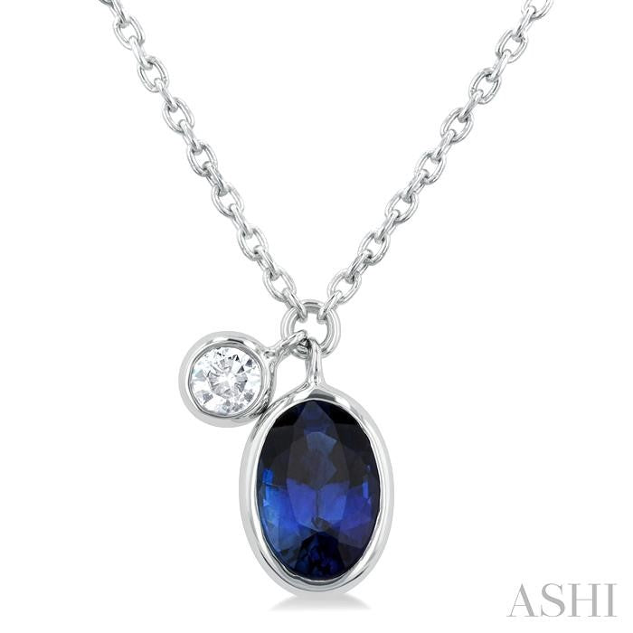 6x4 MM Oval Cut Sapphire and 1/20 Ctw Bezel Set Round Cut Diamond Precious Pendant With Chain in 14K White Gold