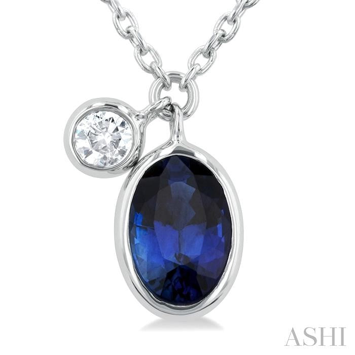 6x4 MM Oval Cut Sapphire and 1/20 Ctw Bezel Set Round Cut Diamond Precious Pendant With Chain in 14K White Gold