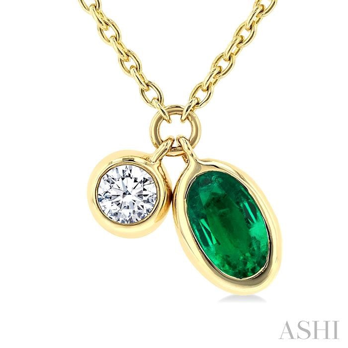 5x3 MM Oval Cut Emerald and 1/50 Ctw Bezel Set Round Cut Diamond Precious Pendant With Chain in 10K Yellow Gold