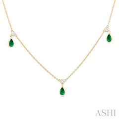 5x3 MM Pear Shape Emerald and 1/8 Ctw Round Cut Diamonds Precious Station Necklace in 10K Yellow Gold